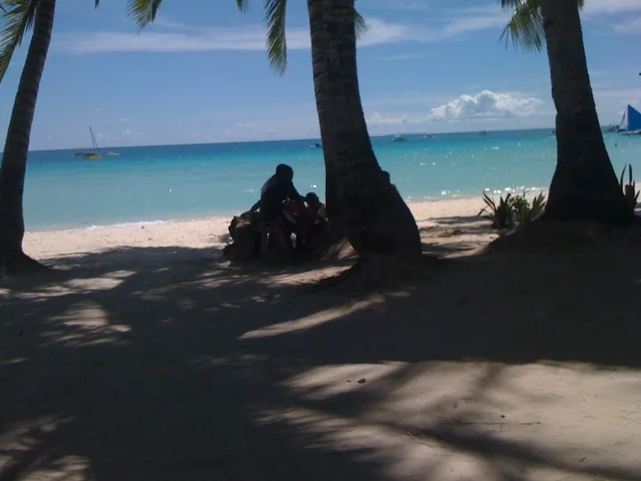 Palm trees and white sand beach at Boracay