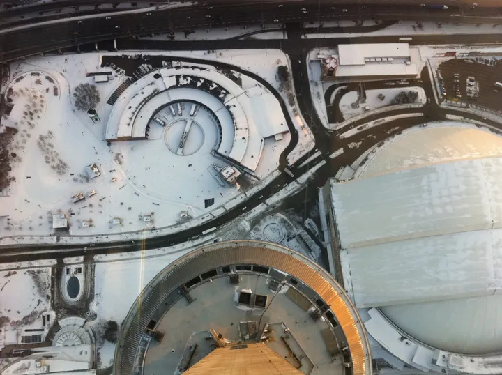 View looking straight down through the CN Tower glass floor, snow-covered ground 1,800 feet below