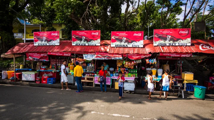 Row of sari-sari stores along the road in San Pablo