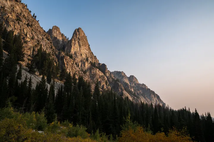 Jagged Sawtooth peaks lit by golden hour light